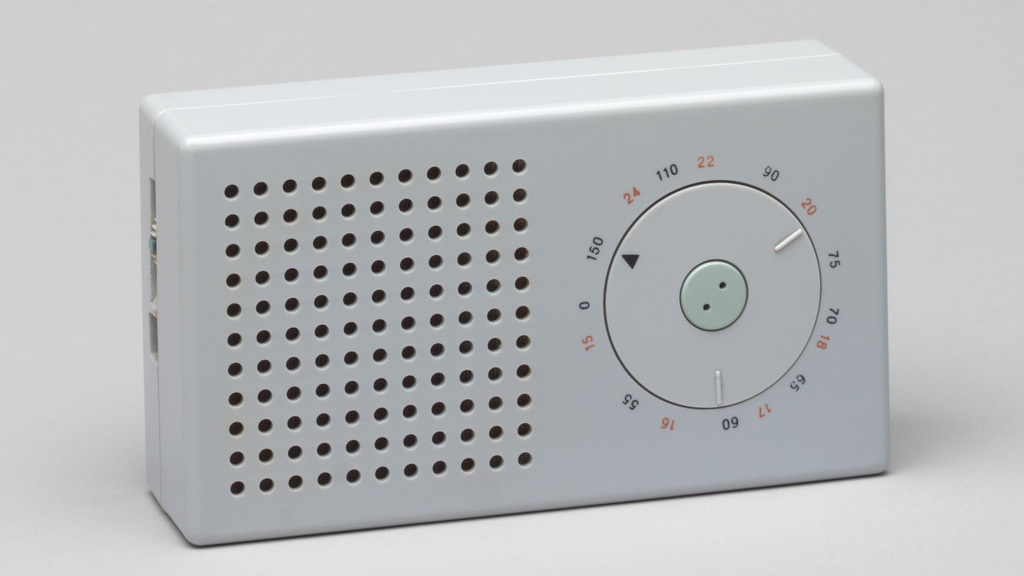 Braun T3 portable radio with a perforated speaker grille and circular tuning dial.