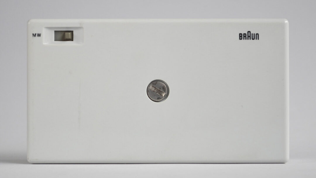 Back of the white Braun T3 radio, with a small Braun logo positioned in the upper-right corner.